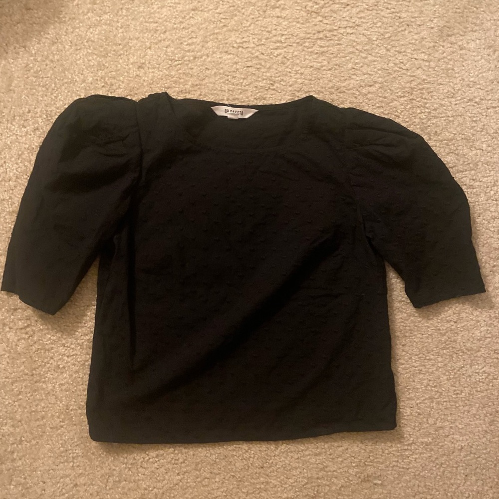Black puff-sleeved swiss dot top